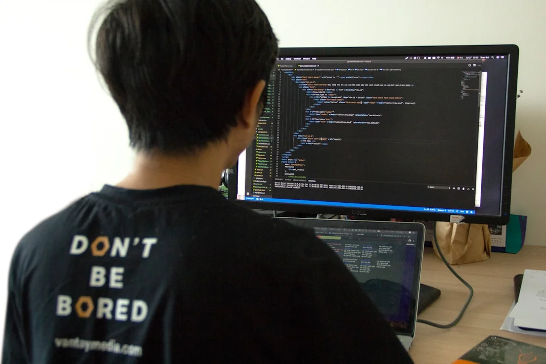 Hands typing on a laptop displaying an e-commerce site in a contemporary office environment.